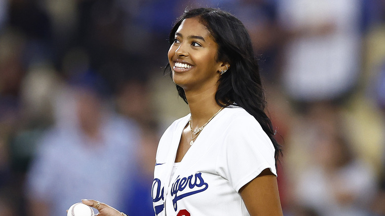 Natalia Bryant smiling in a Dodgers baseball jersey