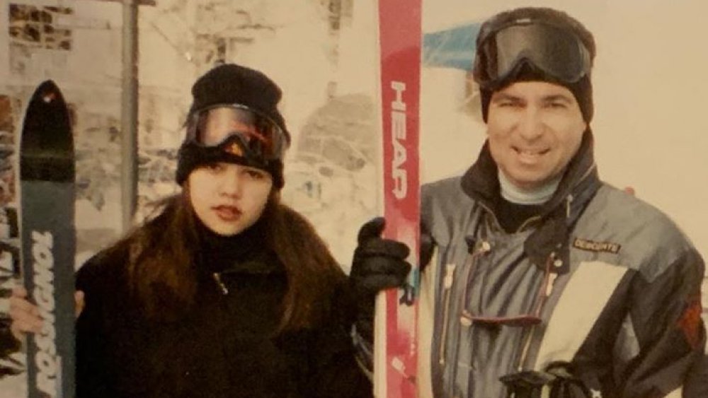 Kourtney Kardashian as a teen with her father, skiing