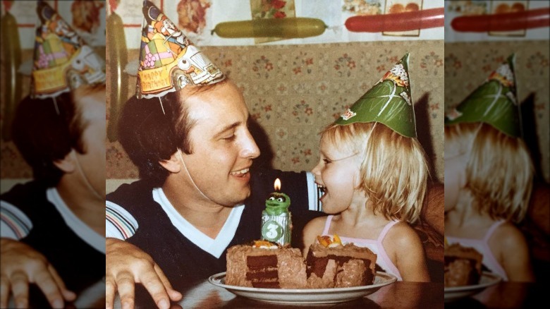 Kristen Bell as a child with her father on her birthday 