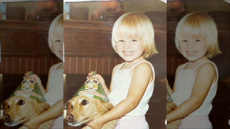 Kristen Bell as a child with a dog