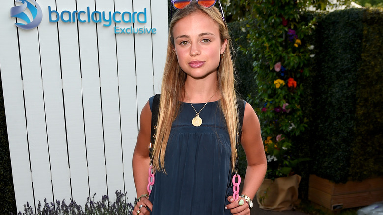 Amelia Windsor posing blue dress