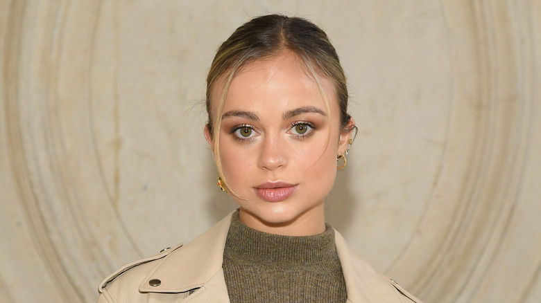 Amelia Windsor posing beige coat