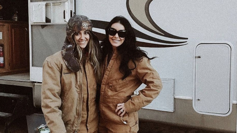 Lainey Wilson and her sister outside her camper