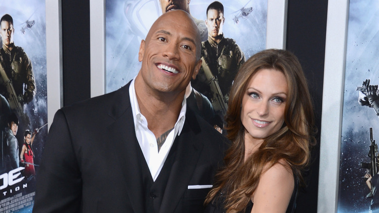 Lauren Hashian and The Rock posing on the red carpet