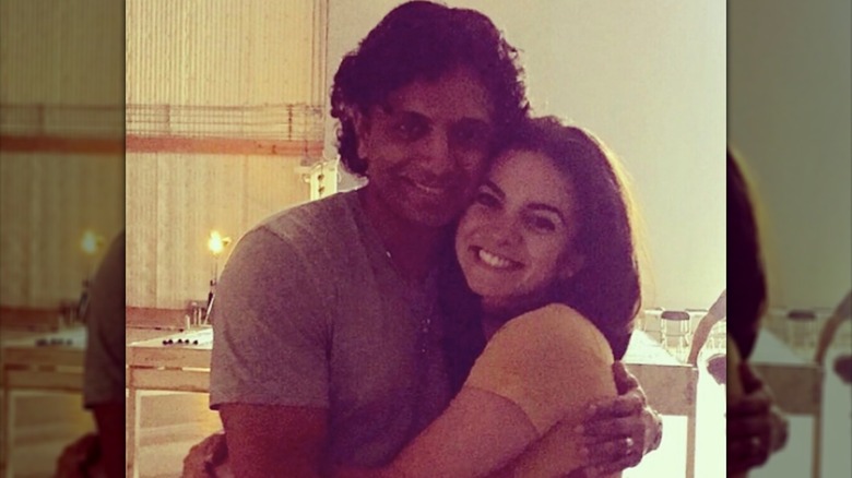 Lauren LaVera posing with director M. Night Shyamalan