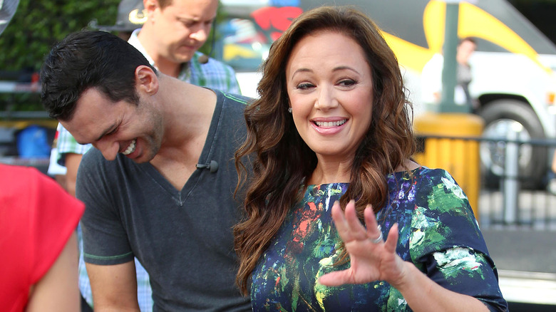 Leah Remini smiling at event