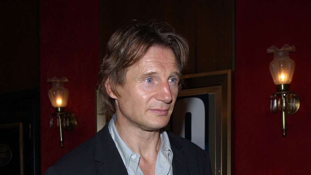 Liam Neeson with shirt unbuttoned