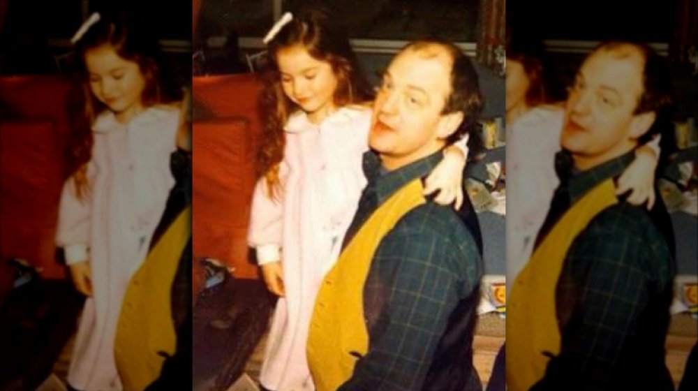 Lily James with her father as a young girl