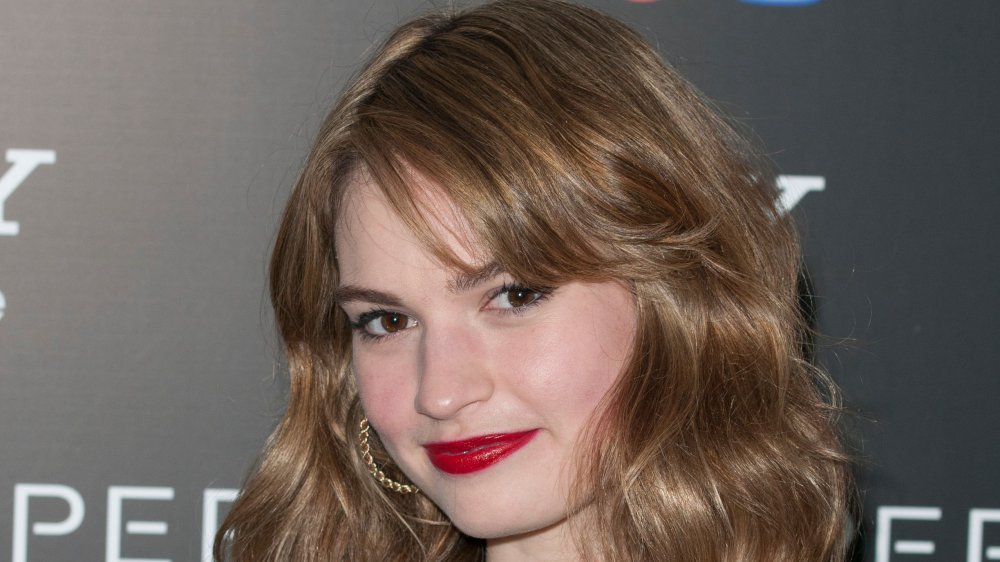 Lily James with a red lip, close-up