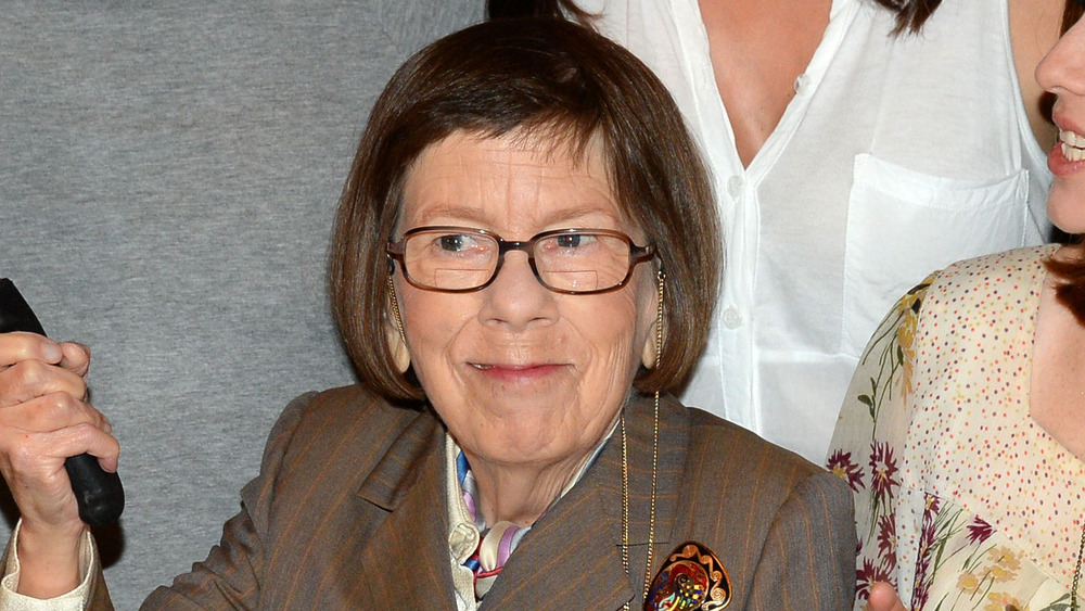 Linda Hunt smiling and posing