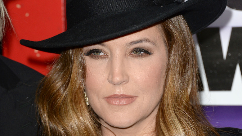 Close-up of Lisa Marie Presley in hat