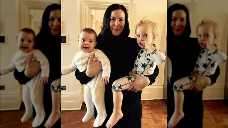 Liv Tyler holding her younger kids