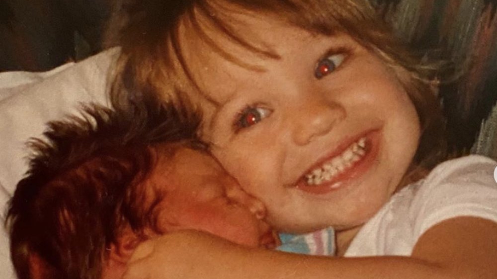 Maddie Ziegler as a kid with her baby sister