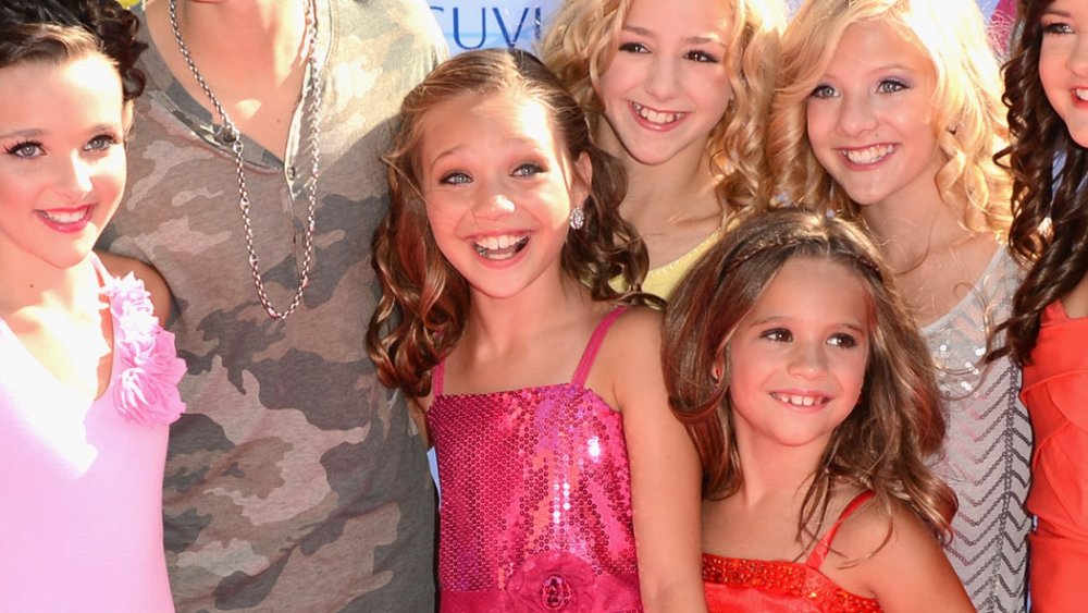 young Maddie Ziegler with the cast of Dance Moms