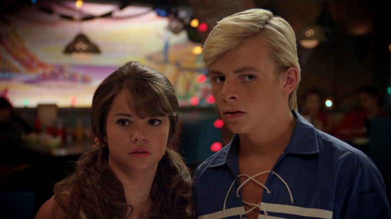 Maia Mitchell and Ross Lynch in a restaurant in Teen Beach Movie