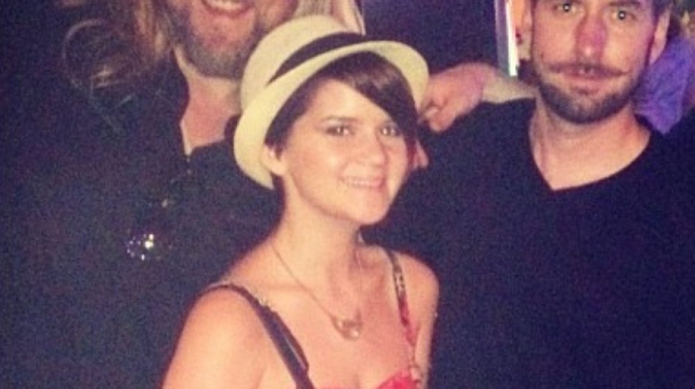 Maren Morris as a young woman wearing a hat