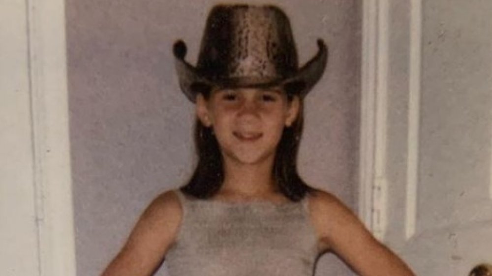 Maren Morris as a tween wearing a cowboy hat