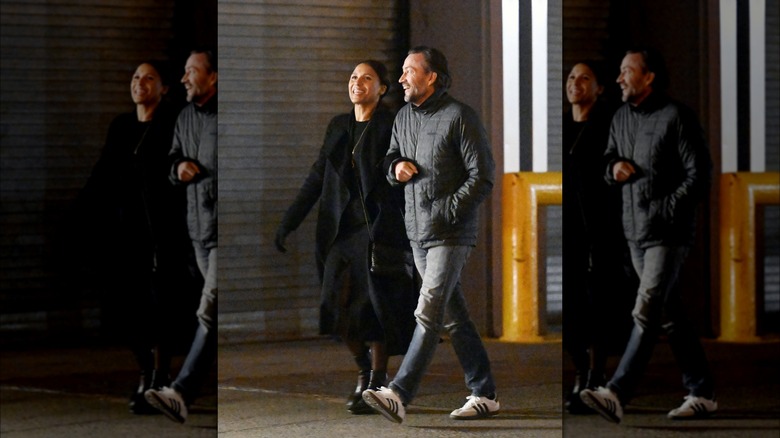 Marilee Fiebig Holmes and Andrew Shue walking and laughing 