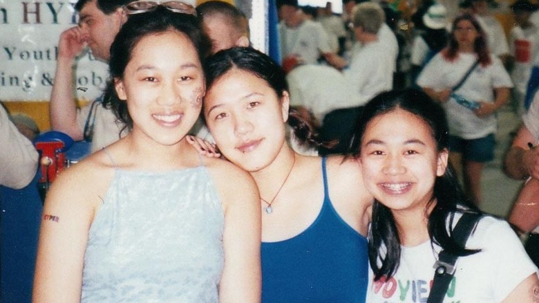 Priscilla Chan posing at a robotics event with friends in high school