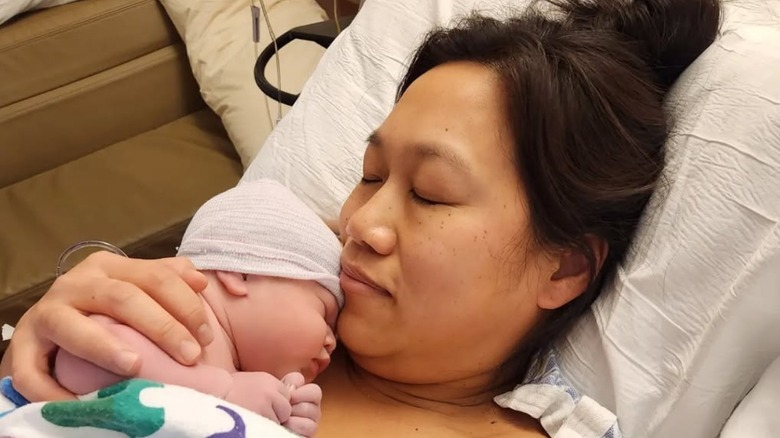 Priscilla Chan holding Aurelia Chan Zuckerberg