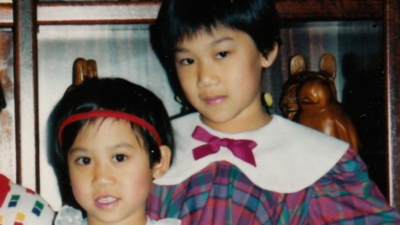 Priscilla Chan posing next to her sister