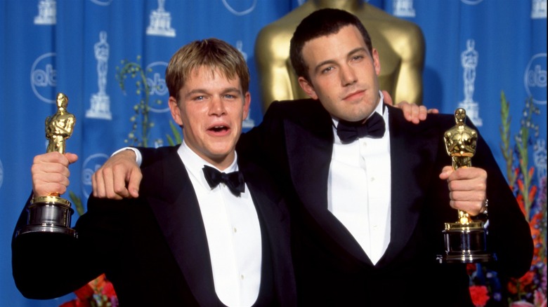 Matt Damon and Ben Affleck holding Oscars