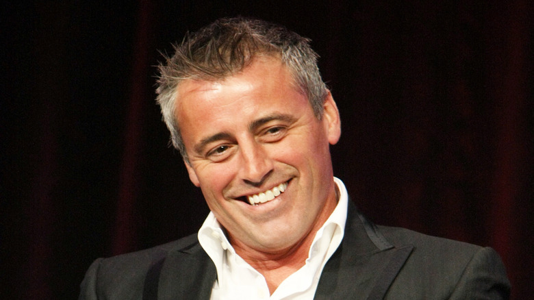 Matt LeBlanc smiling with gray hair