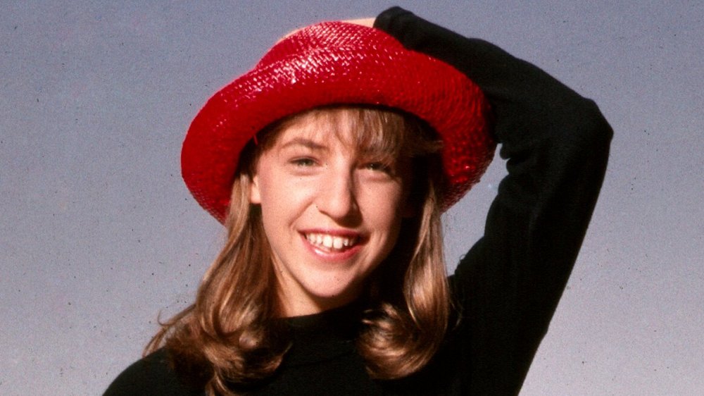 Mayim Bialik as a teenager wearing a hat