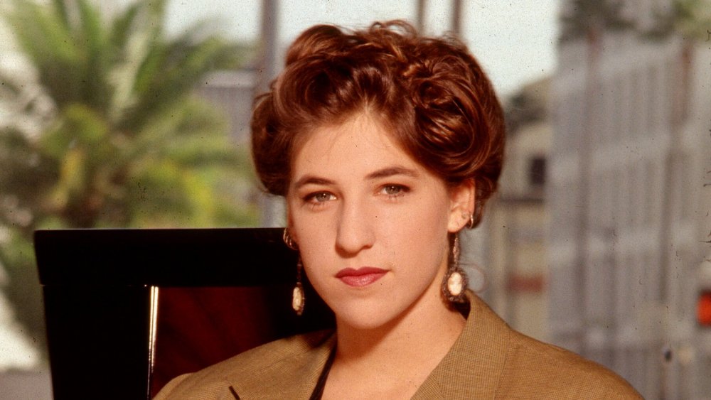Mayim Bialik posing in an office chair