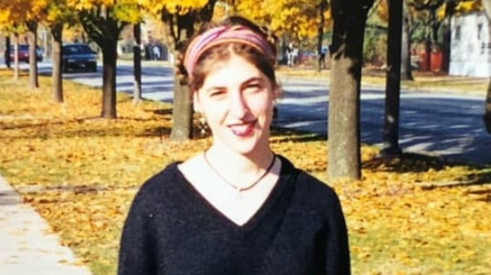 Mayim Bialik as a young woman outside in Autumn