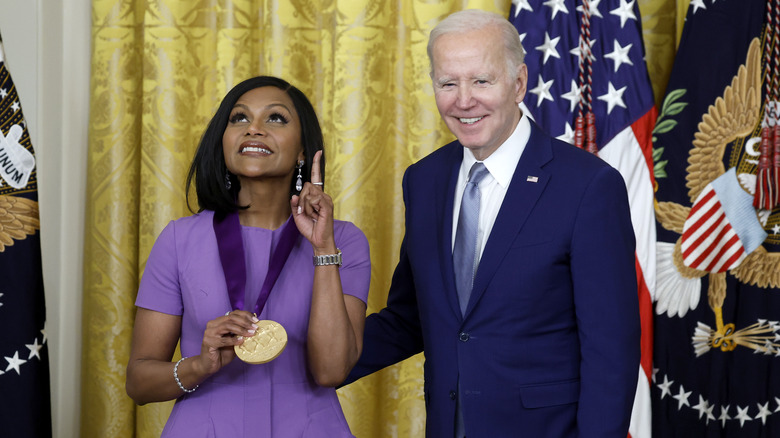 Mindy Kaling smiling with Joe Biden