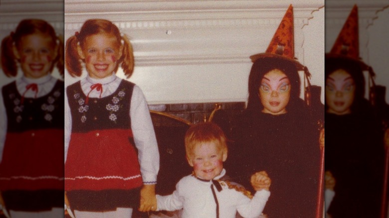 Young Julie Bowen and her sisters in Halloween costumes