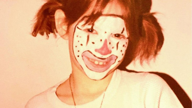 Young Molly Ringwald in clown makeup