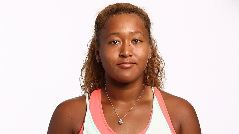 Naomi Osaka posing for a portrait in 2016