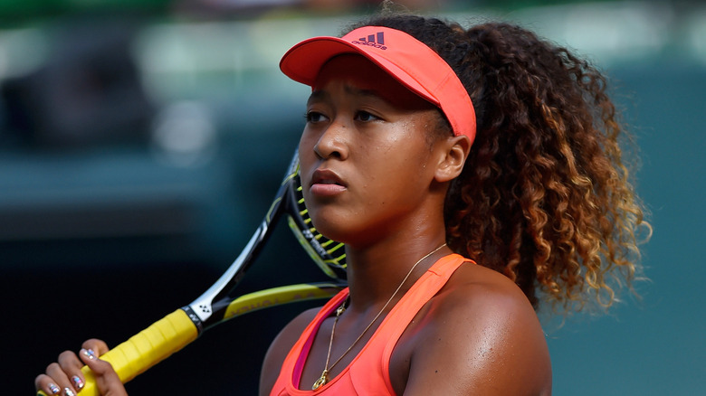 Naomi Osaka playing tennis in 2015