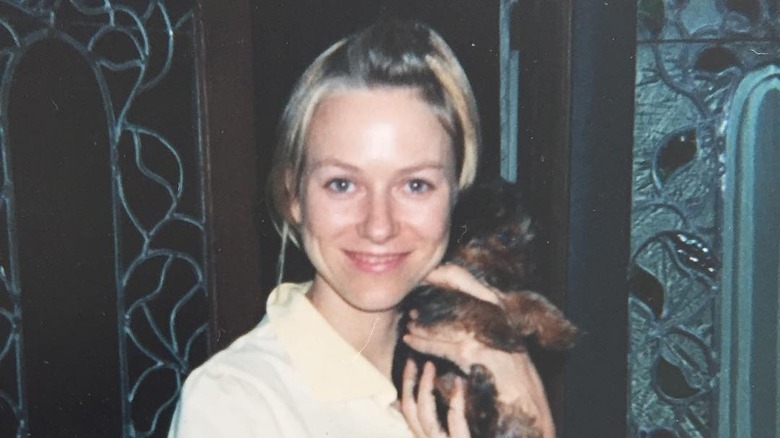 Naomi Watts holding a dog