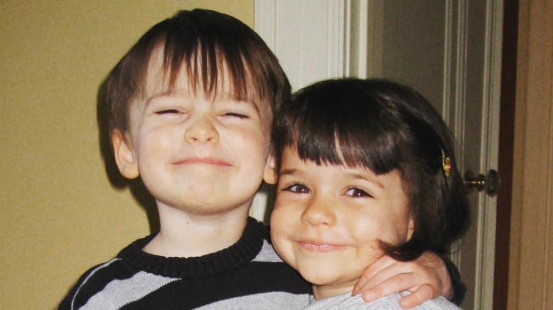 Noah Schnapp as a boy with sister