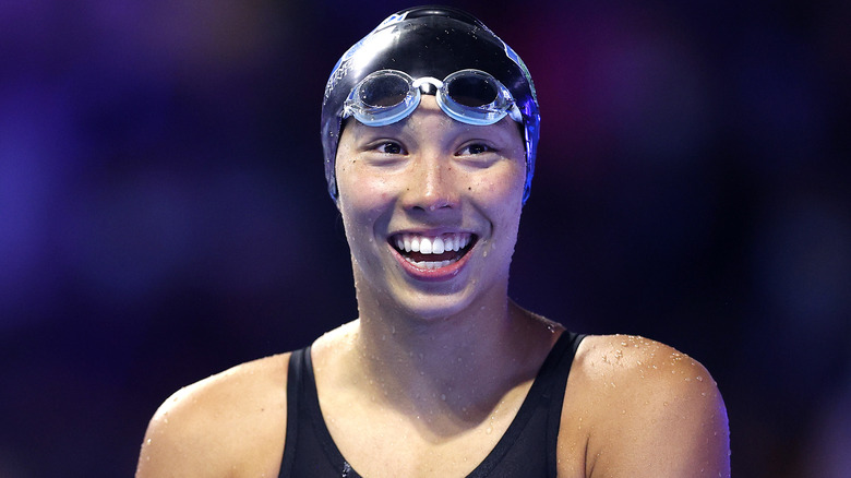 Torri Huske smiling with cap and goggles