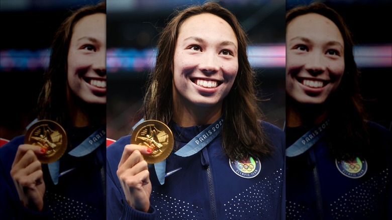 Torri Huske smiling with gold medal 