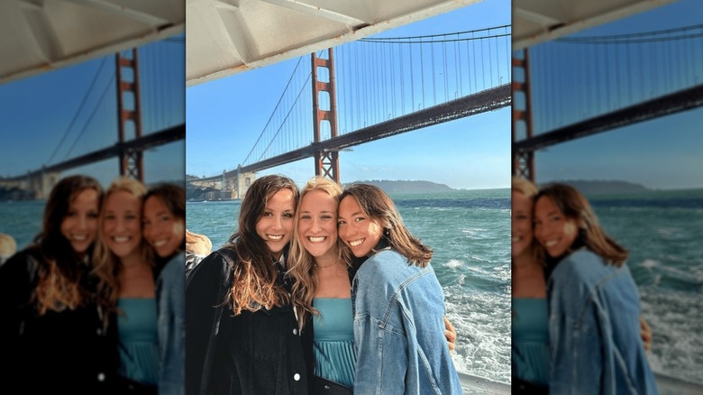 Torri Huske smiling with friends at Golden Gate Bridge