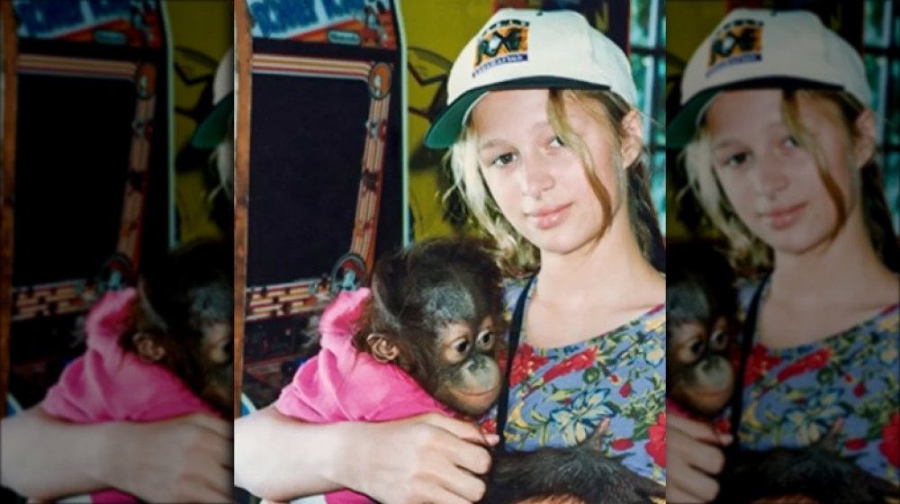 Paris Hilton as a girl with a monkey