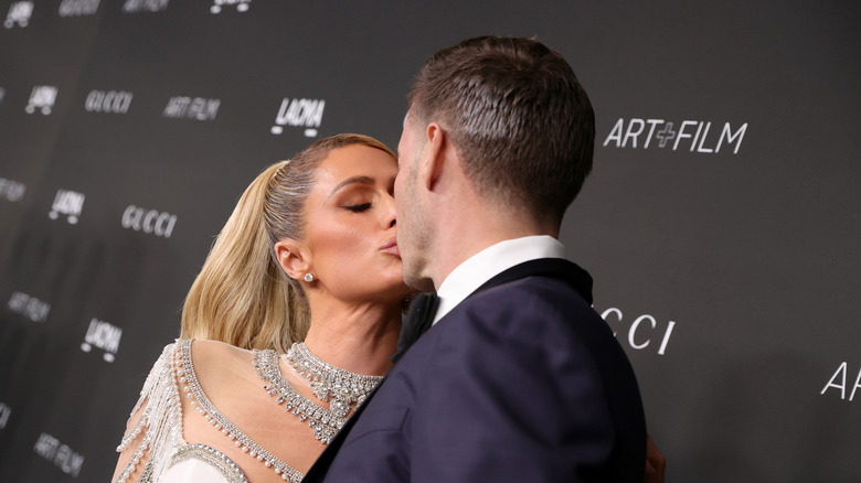 Paris Hilton and Carter Reum sharing a kiss