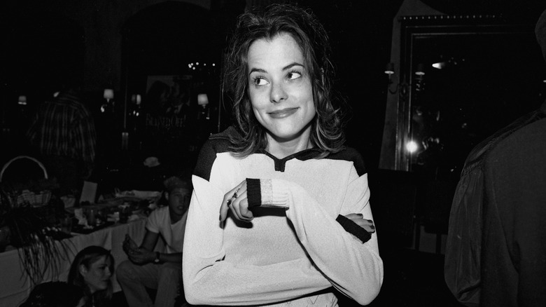 Parker Posey smiling at a party for the film Brassed Off