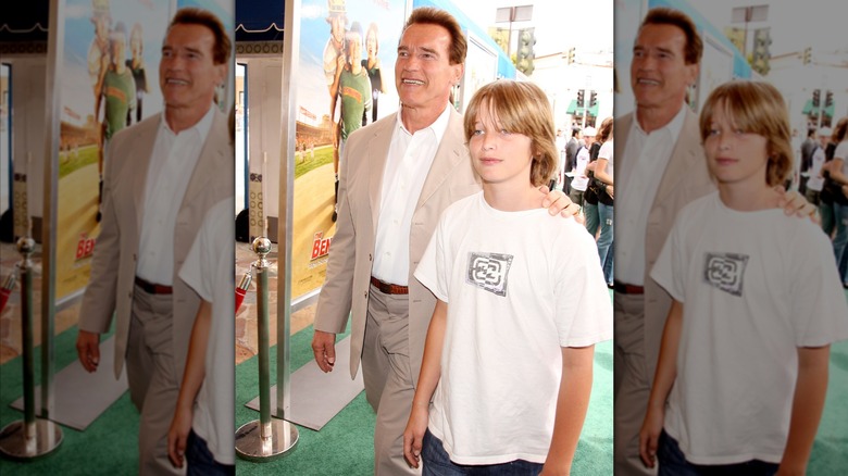 Arnold Schwarzenegger with his hand on Patrick's shoulder at a premiere