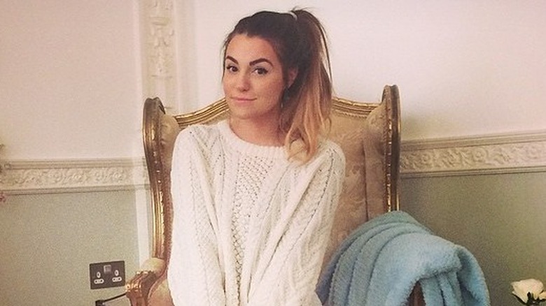 Marzia sitting in a chair