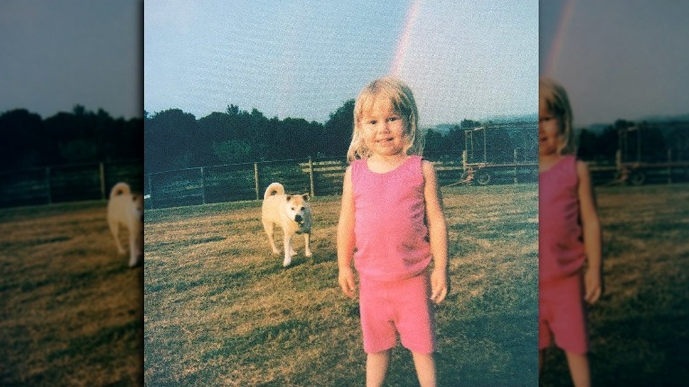 Phoebe Bridgers as a kid wearing pink