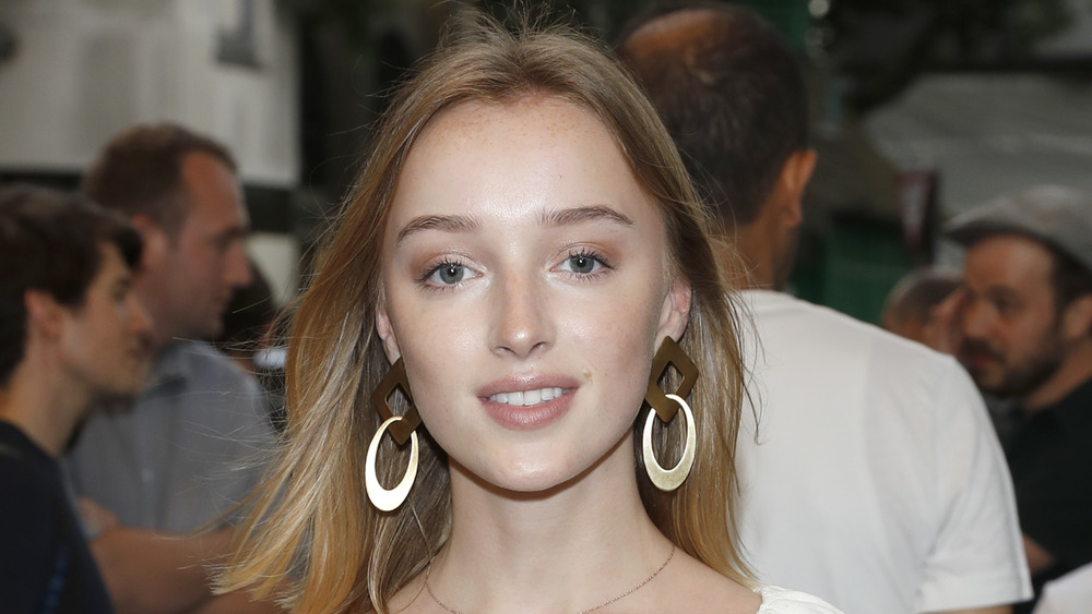 Phoebe Dynevor wearing hoop earrings