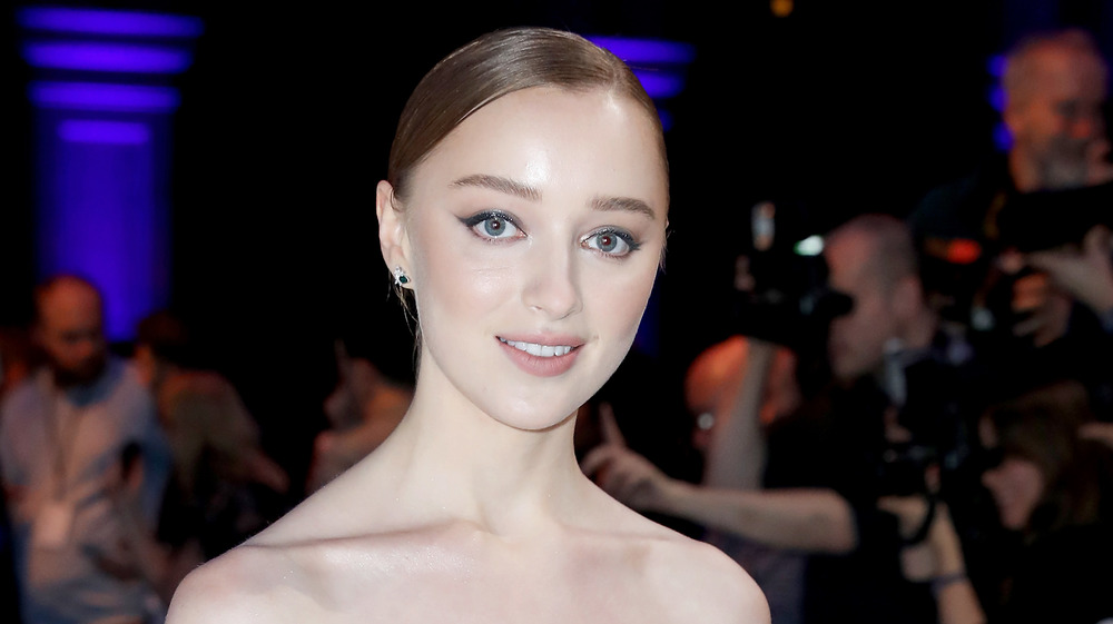 Phoebe Dynevor in front of a film crew