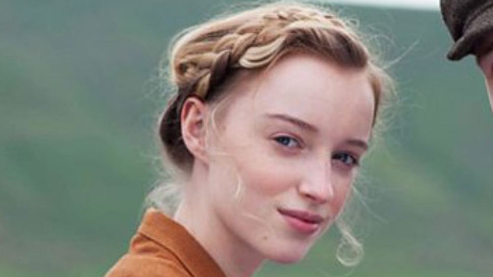 Phoebe Dynevor in front of hills