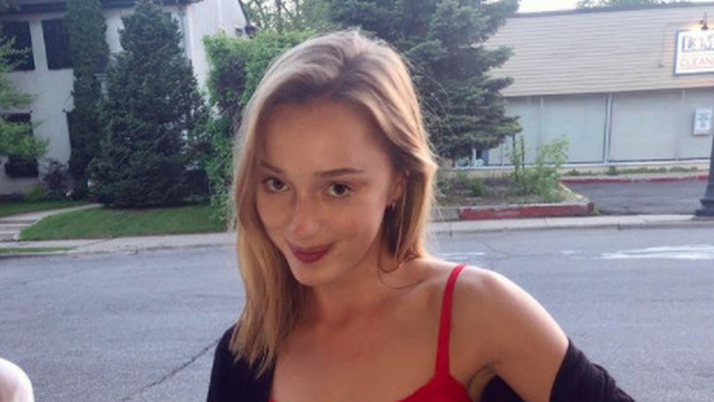 Phoebe Dynevor outside, smiling